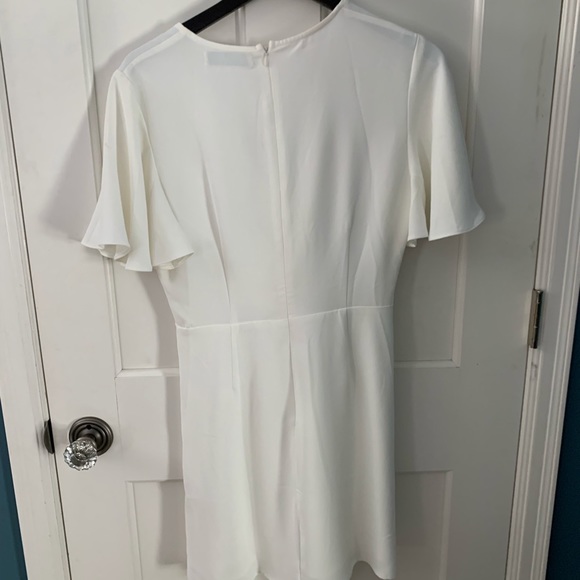 Ivory flutter sleeve ruffle dress. - Picture 5 of 5